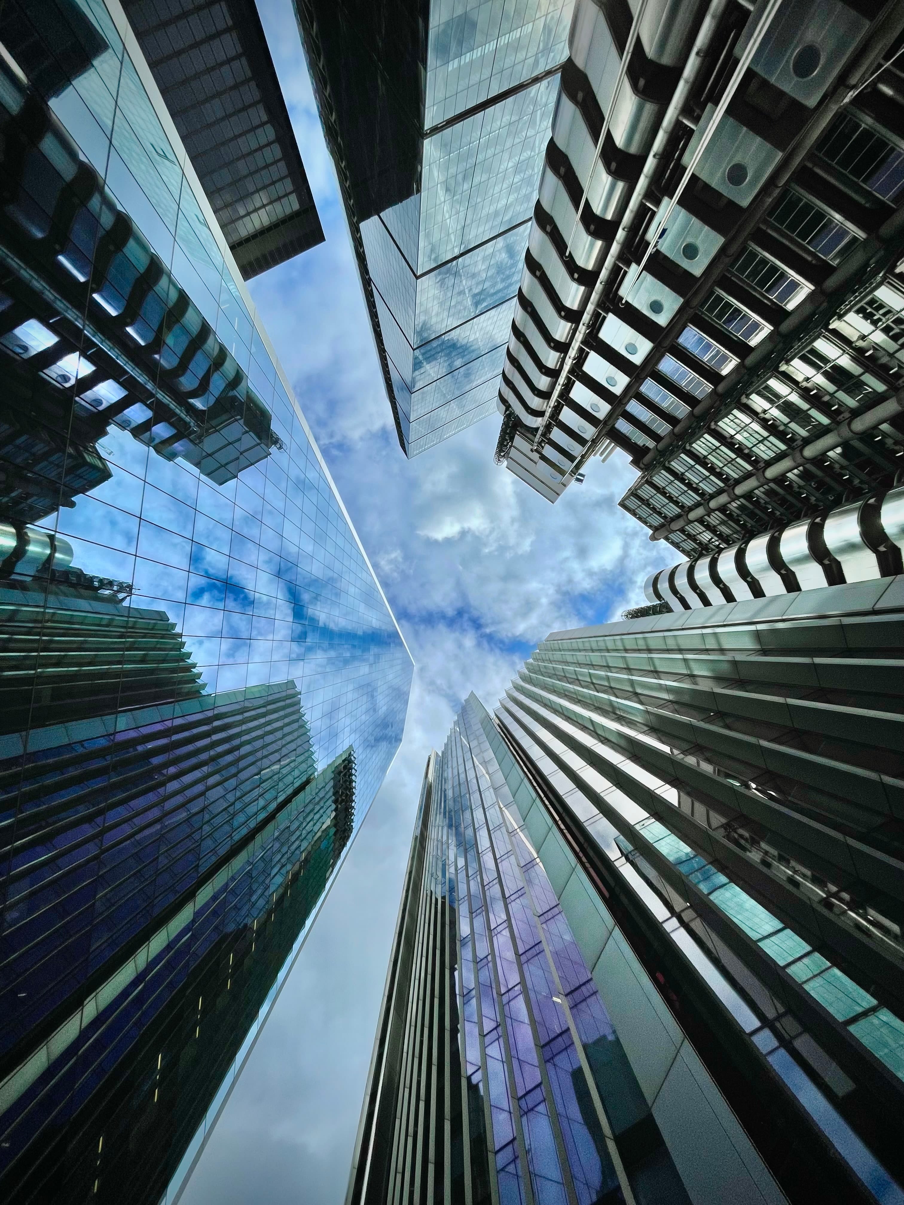 looking up at tall buildings in a city