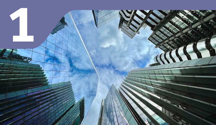 looking up at tall buildings in a city